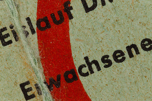 Close-up detail of german text erwachsene and eilauf on aged paper with a red stripe