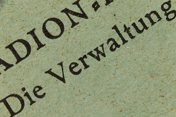 Close-up view of the german word verwaltung on textured green paper