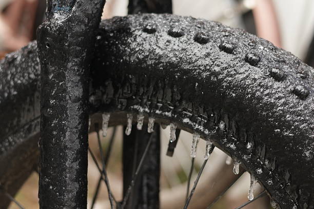 Close-up details of ice buildup and icicles forming on a parked vehicle during a freezing rain event in Texas. Winter weather impact on cars in the southern United States, showing frozen surfaces, ice accumulation, and hazardous cold conditions.
