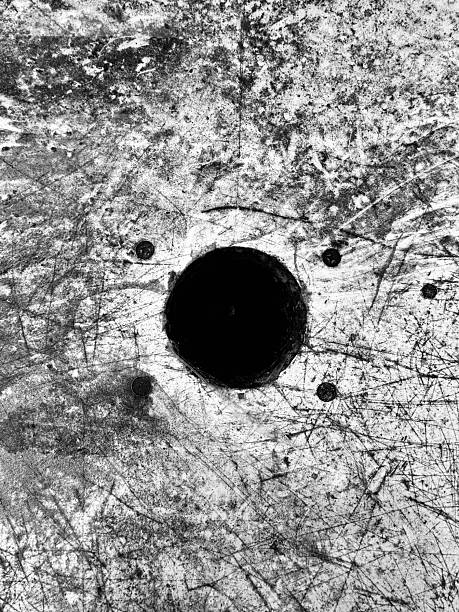 Paper target with bullet holes, close-up photo