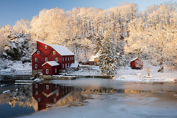 Clinton, USA - January 19, 2026. Red Mill at Sunrise in Winter, Clinton, New Jersey, USA