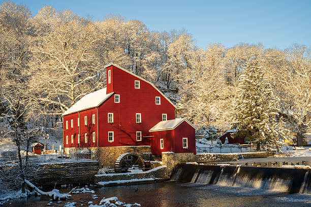 Clinton, USA - January 19, 2026. Red Mill at Sunrise in Winter, Clinton, New Jersey, USA