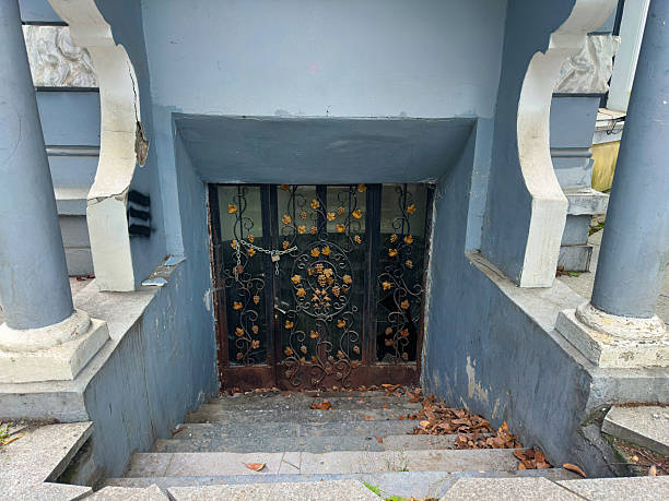 Old Weathered Basement Doorway With Iron Gate Leading Downwards