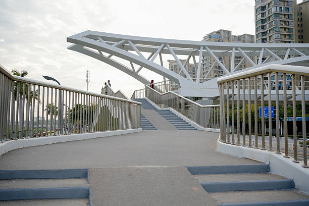 City Life in Motion: People Walking on a Contemporary Pedestrian Bridge