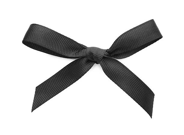Black bow tie on black colored background with copy space for anniversary and invitation concept