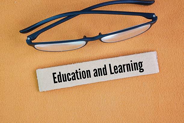 Glasses with the words Education and learning. Learning is a lifelong process of transforming information and experience into knowledge, skills, and behaviors