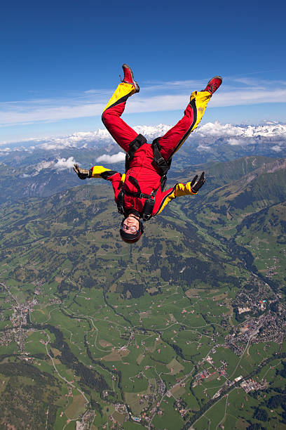 Woman skydiver in free fall upside down