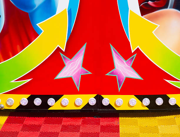 Tauranga New Zealand - April 15 2012; A row of sideshow carnival game clowns with mouths open diminishing into distance.