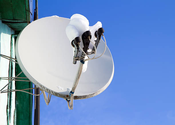 Pop Art of Vibrant Blue and Purple Tone Satellite Dish on the High Building Against Evening Sky