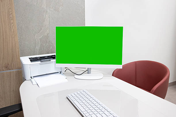 Clean business interior with keyboard printer and chair. Minimal corporate workplace setup.