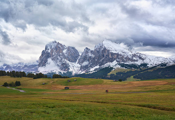 View of the breathtaking Seiser Alm meadow with snowcapped mountain range in Italy. Photographed in medium format.