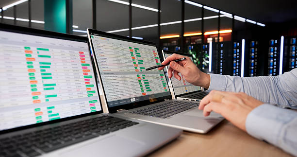 Analyzing Data On Laptop stock photo