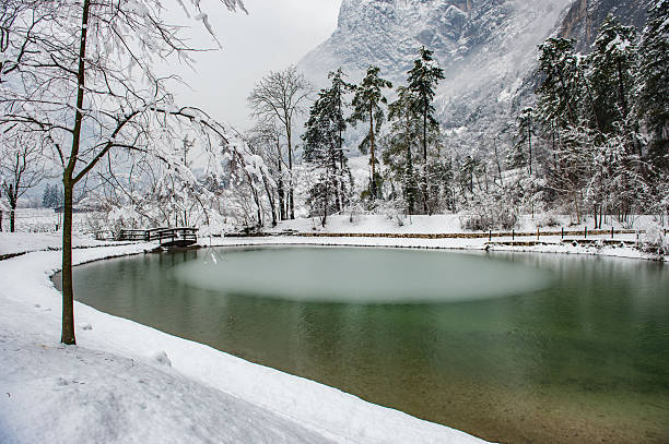 Snowfall in Trentino . Piana Rotaliana , Mezzolombardo e Mezzocorona Andalo , Molveno , Paganella , Fai della Paganella. Dolomiti di Brenta, Vineyard and little lake