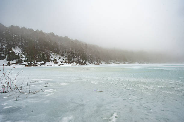 Snowfall in Trentino . Santa Colomba Lake - Lago di Santa Colomba Valsugana