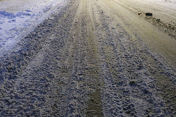 Muddy roads after snow at night