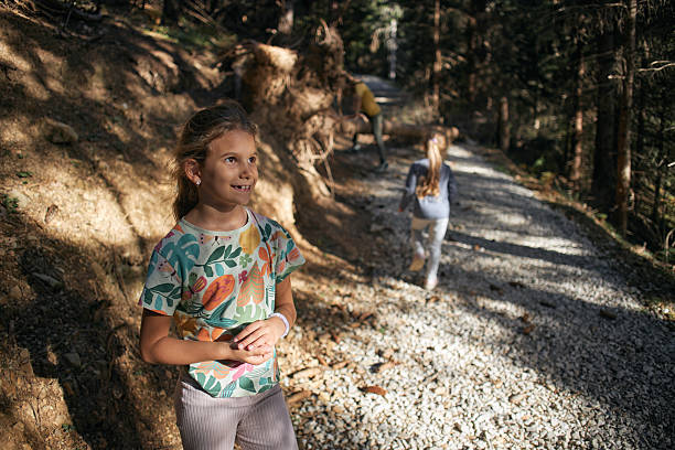 Enjoyable morning at the mountain. Beautiful girl enjoying morning sun.