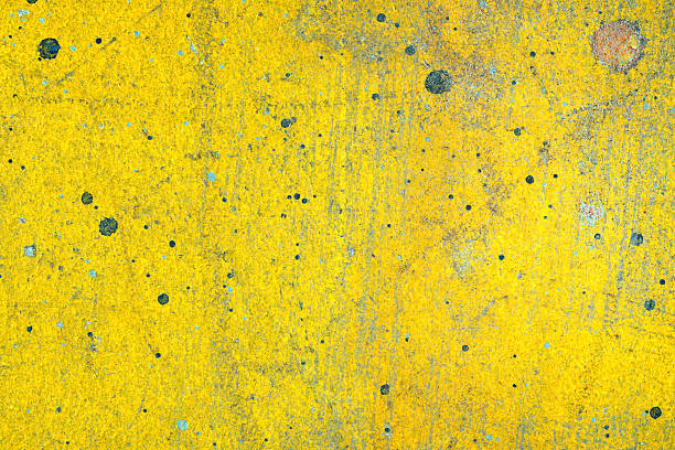Yellow, Grunge paint splattered plaster wall texture background