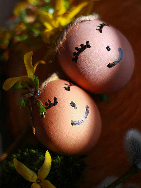 Painted Easter eggs with smiling faces in close up and soft light. Concept of Easter celebration, playful emotion, holiday background for card, social media, retail design.