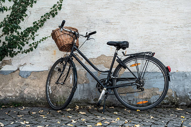 City Bicycle Against an Old Wall . A quiet moment of slow urban life, where movement pauses and time becomes visible.