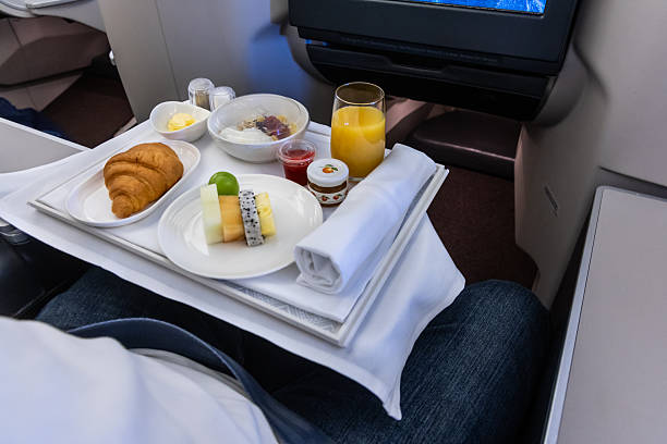 In-flight luxurious business class breakfast served on table cloth and tableware for comfortable experience and journey
