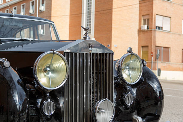 Rolls Royce Silver Cloud 1961 classic luxury car dashboard with wood and chrome upholstery.