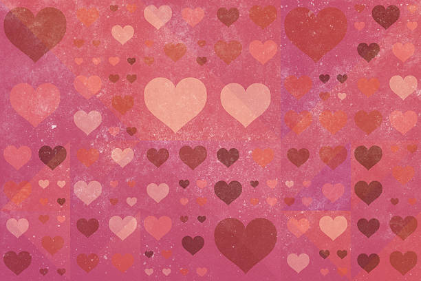 This artistic background showcases a textured pattern of varying-sized hearts in a vibrant palette of pink and red tones. The abstract design evokes feelings of romance and affection, perfect for Valentine's Day or other expressions of love.