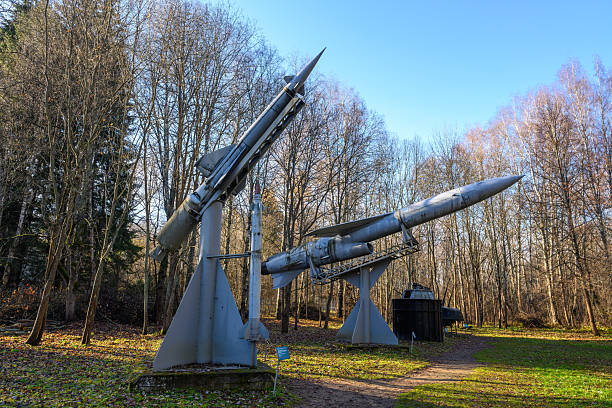 Pereslavl-Zalessky, Russia - November 4, 2025: Two Soviet missiles stand tall in Pereslavl-Zalessky, set against a backdrop of trees and clear blue skies, showcasing a blend of history and nature.