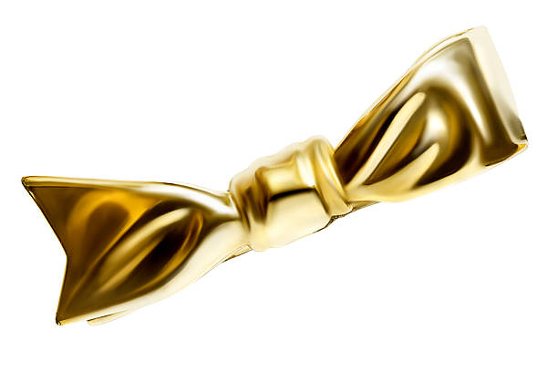 Golden brooch in the shape of a bow isolated on white background