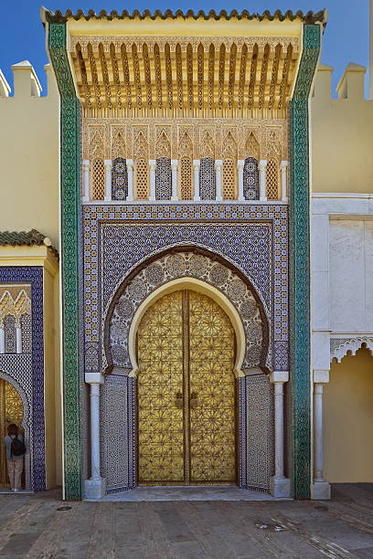 Fez, Morocco-April 2, 2023: Royal Palace, second left of the 1969-71 built seven gates facing SW onto the Alawites Square, richly decorated with mosaic, carved cedar wood, geometric-motif gilt bronze.