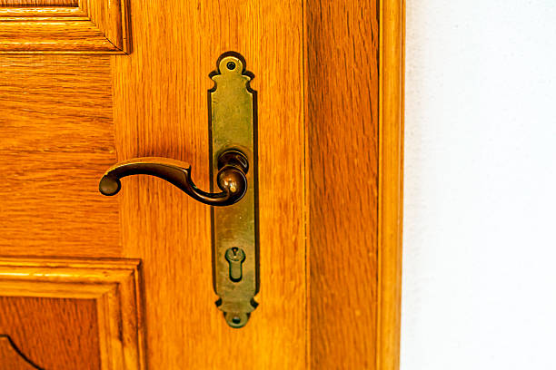 metal, openwork handle on a wooden interior door