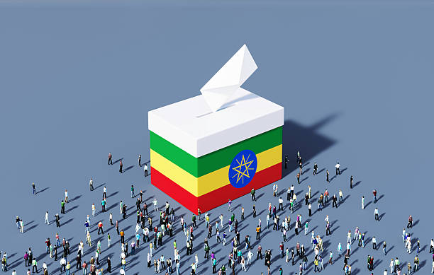Ballot box textured by Ethiopian flag surrounded by human crowd. Horizontal composition. Election concept.