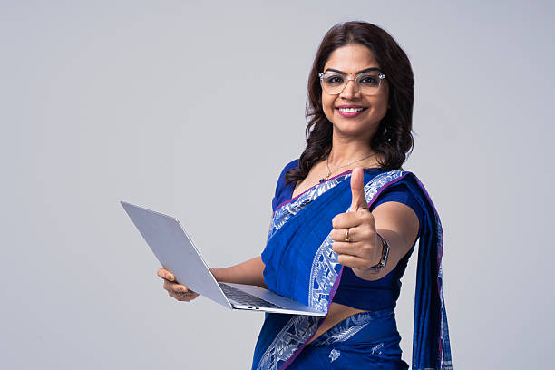 Stylish Indian woman in silk saree and nose ring with OK gesture. Front pose