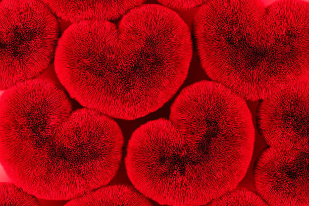 istock Pattern of red fluffy heart shapes with soft fur texture. Romantic abstract background symbolizing love, passion and warmth, perfect for Valentine’s Day designs, cards, banners and festive visuals. 2258328705