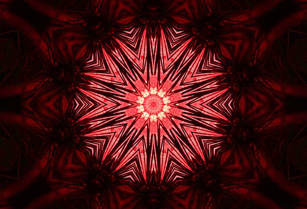 Closeup of electric bulb on Christmas tree through kaleidoscope lens.