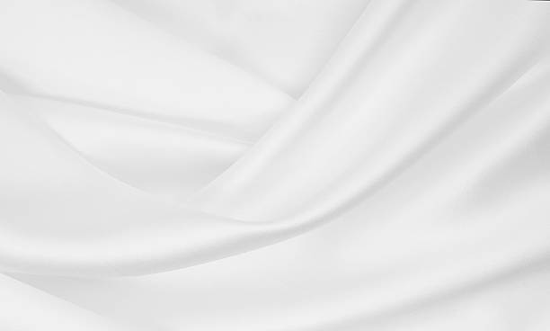 istock Smooth elegant white silk or satin luxury cloth texture as wedding background. Luxurious background design 2258331215