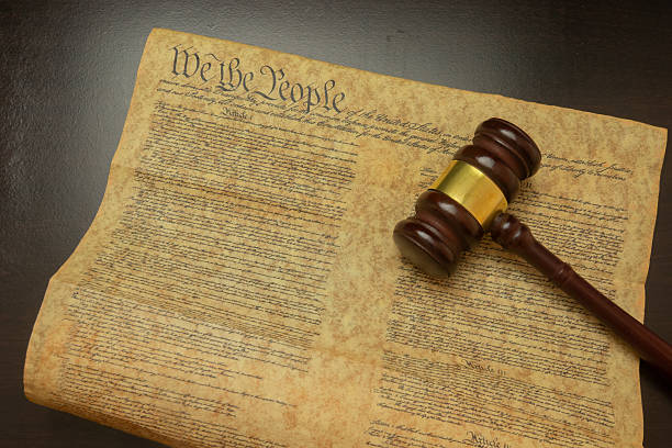 A judicial gavel resting beside the US Constitution, symbolizing American law, constitutional authority, and the enduring principles of justice, democracy, and the rule of law