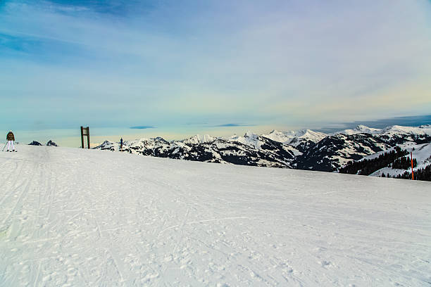 Snowy off-piste slope for freeride with traces from skis, snowboards
