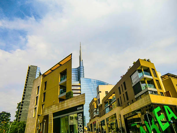 New building, Garibaldi area, Unicredit Tower, Milano, Milan, Lombardy, Italy, Europe. The image shows the modern Porta Nuova district in Milan, Italy, featuring the UniCredit Tower. The UniCredit Tower is an office skyscraper and is recognized as the tallest building in Italy, reaching 238 meters with its spire. The area around it, including Corso Como and Piazza Gae Aulenti, is a vibrant business and shopping district known for its contemporary architecture and high-fashion showrooms.