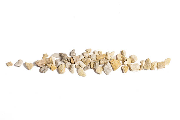 A stack of small brown decorative stones isolated on white background, stone chips
