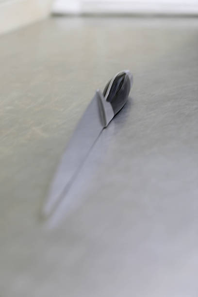 Kitchen Knife Lying On Brushed Metal Surface