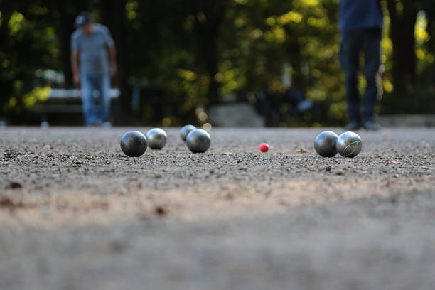 detail image of people playing boules in a park