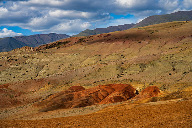 Scenic views and SUV truck recreationally driving dusty dirt roads in backcountry.