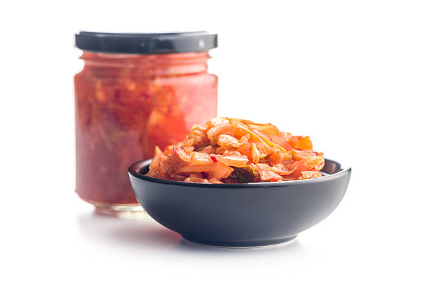Fermented cabbage. Kimchi. Korean food in bowl isolated on a white background.