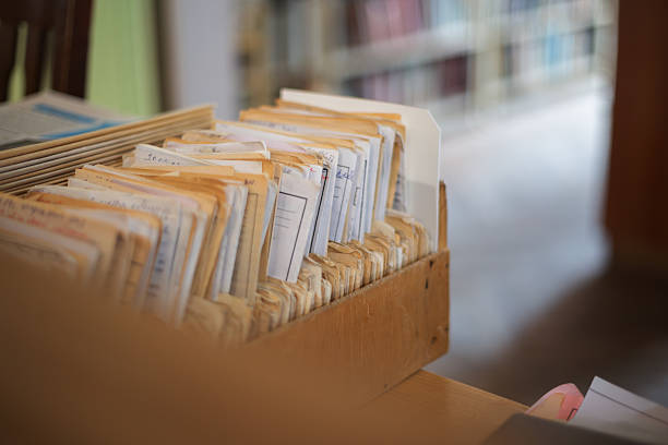 Old paper index cards organizing information in a traditional library or archive
