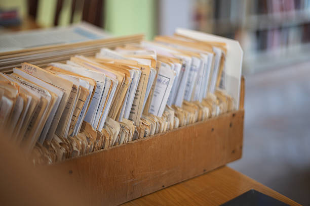 Files and documents storing information in a vintage library catalog
