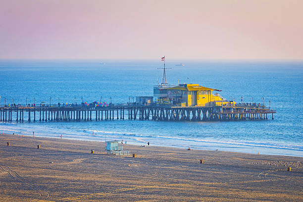 Scenic sunset view of Santa Monica Pier overlooking the beach and Pacific Ocean in California