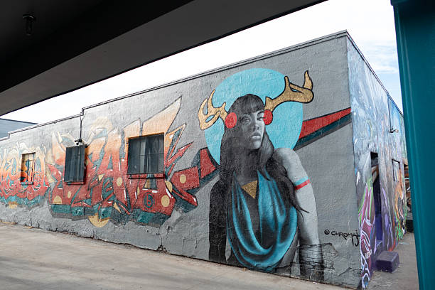 Denver, USA - December 24, 2019: colorful mural at an old brick wall.