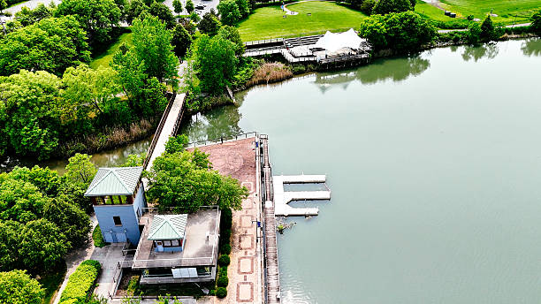 The shores of the lake that appears to sit idle and the amenities that surround it.
