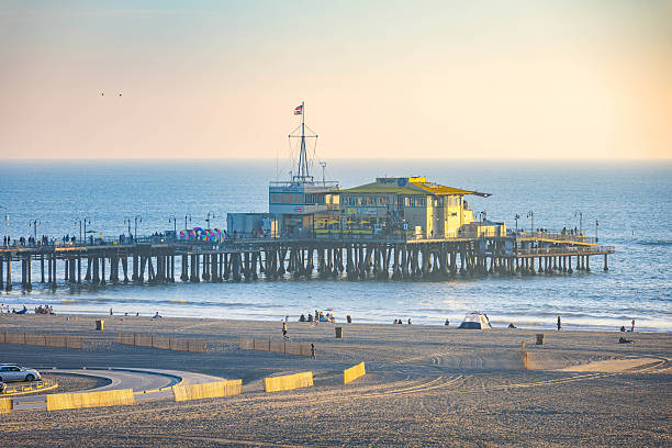 Los Angeles, CA, USA - December 01, 2025: Scenic sunset view of Santa Monica Pier overlooking the beach and Pacific Ocean in California