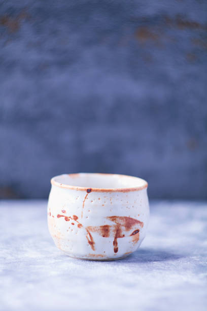 Traditional japanese ceramic on rustic wooden background. Soft focus. Copy space.